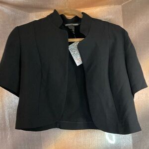 Short sleeve size 8 black jacket. 39” chest Nicole‎ Studio 400